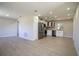 Modern kitchen boasts stainless steel appliances, white cabinetry, and open floor plan, perfect for entertaining at 453 E Jessup Ave, Longwood, FL 32750