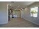 Bright and airy interior showcasing an open floor plan with kitchen featuring stainless steel appliances and modern finishes at 453 E Jessup Ave, Longwood, FL 32750
