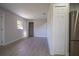 Spacious and modern living area featuring new flooring, fresh paint, and ample natural light, with a pantry/storage closet at 453 E Jessup Ave, Longwood, FL 32750
