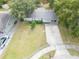 Inviting single-story home with well-kept lawn, long driveway, and mature landscaping at 4760 Danzig Ct, Orlando, FL 32811