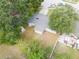 Aerial view of property with a detached garage, fenced yard and mature trees at 4760 Danzig Ct, Orlando, FL 32811