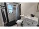 Bathroom featuring a shower, toilet and sink, with black and white tiling accents at 4760 Danzig Ct, Orlando, FL 32811