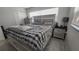 Cozy bedroom with a soft plush blanket and light wood trim at 4760 Danzig Ct, Orlando, FL 32811