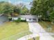 A charming, fenced single-story home with an inviting front porch and established landscaping at 4760 Danzig Ct, Orlando, FL 32811