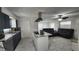 Modern kitchen featuring an island cooktop, stainless steel appliances, and open layout at 4760 Danzig Ct, Orlando, FL 32811