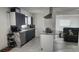 Updated kitchen features sleek gray cabinets, stainless steel appliances, and marble countertops at 4760 Danzig Ct, Orlando, FL 32811