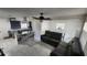 Open floor plan with modern kitchen featuring an island cooktop, stainless appliances, and an open layout at 4760 Danzig Ct, Orlando, FL 32811
