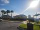 Beautiful community clubhouse and palm trees on a sunny day, with parking available at 4819 Apple Blossom Ln, St Cloud, FL 34771
