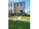 Inviting two-story home featuring neatly trimmed hedges and a well-manicured front lawn at 4819 Apple Blossom Ln, St Cloud, FL 34771