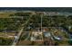 Aerial view with property boundary highlighting neighborhood, mature trees and residential street at 4885 Meadow Dr, St Cloud, FL 34772