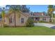 Charming single-Gathering home with a well-maintained lawn, mature landscaping, and a welcoming front entrance at 4885 Meadow Dr, St Cloud, FL 34772