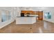 Inviting kitchen boasts wood cabinetry, a breakfast bar, and modern appliances creating a welcoming atmosphere at 4885 Meadow Dr, St Cloud, FL 34772