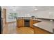 Beautiful kitchen with wood cabinets, countertops, and a stainless steel dishwasher creates a functional cooking space at 4885 Meadow Dr, St Cloud, FL 34772