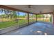 Spacious screened-in patio offering a tranquil view of the lush backyard at 4885 Meadow Dr, St Cloud, FL 34772