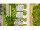A bird's-eye view of several homes, emphasizing their neat landscaping and neighborhood street layout at 5426 Astor St, Leesburg, FL 34748