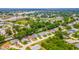 Bird's eye view of a neighborhood with a lake and lush greenery at 5426 Astor St, Leesburg, FL 34748