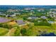 Community aerial highlighting the lake, ball field, tennis courts and pool at 5426 Astor St, Leesburg, FL 34748