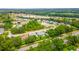 Community aerial showcasing winding streets and lush green trees at 5426 Astor St, Leesburg, FL 34748