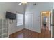 Bedroom showcasing laminate floors, a closet, and a window at 5426 Astor St, Leesburg, FL 34748