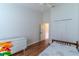 Bright bedroom features wood floors, a closet, and a white dresser at 5426 Astor St, Leesburg, FL 34748