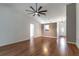 Inviting living room featuring wood floors, neutral paint, and a modern ceiling fan at 5426 Astor St, Leesburg, FL 34748