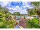 Beautiful pool and recreational area complete with lovely landscaping and comfortable seating at 5426 Astor St, Leesburg, FL 34748