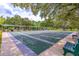 Multiple outdoor shuffleboard courts provide recreational space surrounded by mature trees at 5426 Astor St, Leesburg, FL 34748