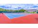 Two outdoor tennis courts in a vibrant community setting are ready for play at 5426 Astor St, Leesburg, FL 34748