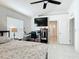 Cozy bedroom with ceiling fan, work station, and comfortable bed at 5577 Sycamore Canyon Dr, Kissimmee, FL 34758