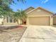 Charming single-Gathering home featuring a two-car garage, well-maintained lawn, and a tidy landscape at 5577 Sycamore Canyon Dr, Kissimmee, FL 34758