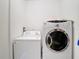 Functional laundry area with a modern dryer and washing machine at 5577 Sycamore Canyon Dr, Kissimmee, FL 34758