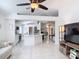 Open-concept living space showcasing kitchen, breakfast nook, living room and hallway at 5577 Sycamore Canyon Dr, Kissimmee, FL 34758