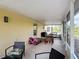 Relaxing screened porch with outdoor seating, open view and play area at 5577 Sycamore Canyon Dr, Kissimmee, FL 34758