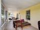 Relaxing screened porch with outdoor seating, open view and play area at 5577 Sycamore Canyon Dr, Kissimmee, FL 34758