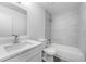 This updated bathroom features modern fixtures and white marble-look shower tiling at 5642 Chukar Dr, Orlando, FL 32810