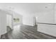 Bright open floor plan featuring light gray wood floors, neutral walls, and ample natural light at 5642 Chukar Dr, Orlando, FL 32810