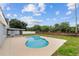 An eye-level view of the freeform pool and screened-in patio at 5642 Chukar Dr, Orlando, FL 32810