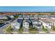 A beautiful aerial view of a suburban neighborhood with lush greenery and well-maintained homes at 7184 Oakmoss Loop, Davenport, FL 33837