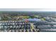 Aerial view of residential area with nearby lake, showcasing the neighborhood's layout at 7184 Oakmoss Loop, Davenport, FL 33837