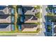 Aerial view of a house with a screened-in pool in a residential area at 7184 Oakmoss Loop, Davenport, FL 33837
