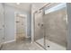 Light and bright bathroom with glass enclosed shower and walk-in closet at 7184 Oakmoss Loop, Davenport, FL 33837