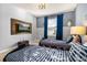 The bedroom features themed decor, two beds and mounted TV, creating an immersive and entertaining space at 7184 Oakmoss Loop, Davenport, FL 33837