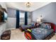 bedroom featuring train beds, carpet and wainscoting at 7184 Oakmoss Loop, Davenport, FL 33837