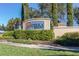 Welcoming entrance sign to Solterra Resort, surrounded by manicured landscaping and lush greenery at 7184 Oakmoss Loop, Davenport, FL 33837