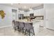 Kitchen featuring an island with barstool seating and pendant lighting at 7184 Oakmoss Loop, Davenport, FL 33837