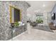 A modern living space flows from the foyer with tile floors, with a sofa and an entertainment center at 7184 Oakmoss Loop, Davenport, FL 33837