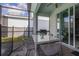 The outdoor dining space includes patio furniture and a grill, perfect for outdoor gatherings at 7184 Oakmoss Loop, Davenport, FL 33837