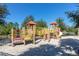 A colorful playground with slides, climbing structures, and a sand base for safe play at 7184 Oakmoss Loop, Davenport, FL 33837