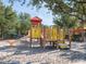 Community playground with slides and climbing structures in a safe and inviting environment at 7184 Oakmoss Loop, Davenport, FL 33837