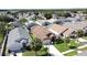 An aerial capture displaying a variety of homes in a community, accented with palm trees and green spaces at 8019 Indian Creek Blvd, Kissimmee, FL 34747